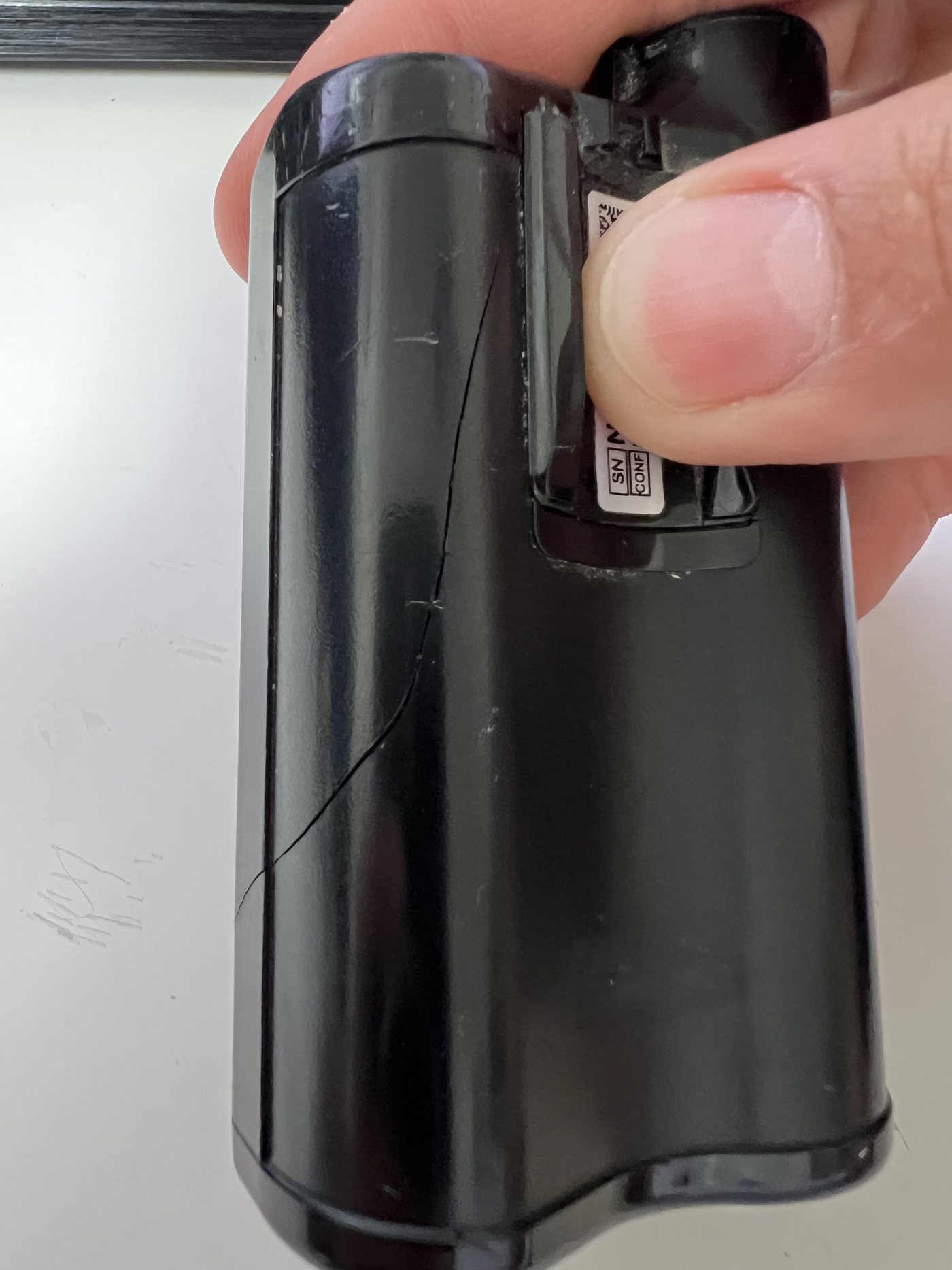Close-up of the cracked housing on the damaged insulin pump.